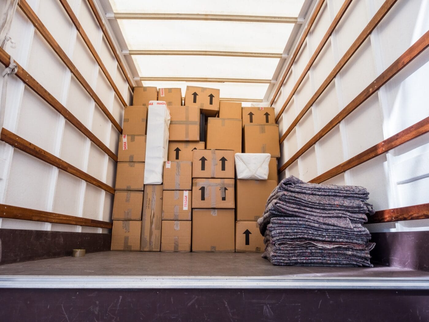 A moving truck being loaded with boxes